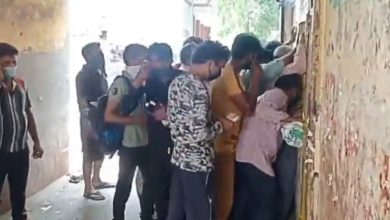 A huge crowd of people at the liquor store in Bijnor