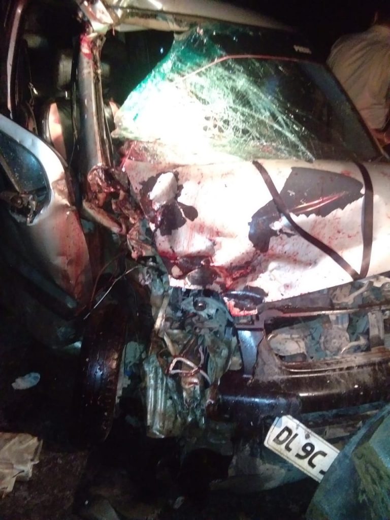 Traumatic death of a person riding a bike in a collision between a car and a bullet