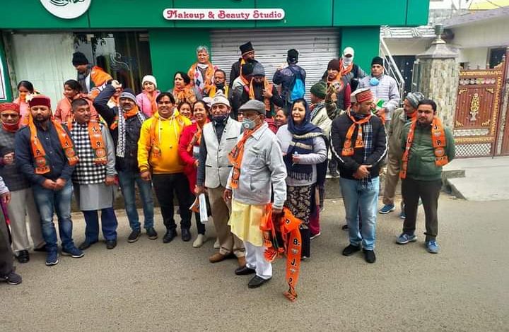 BJP workers run BJP door-to-door campaign of BJP